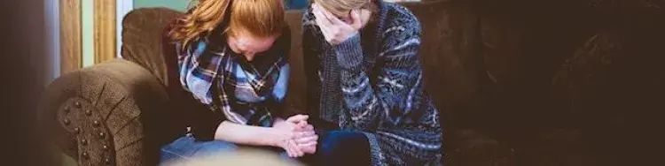 two people praying together