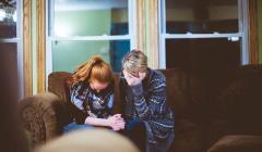 two people praying together